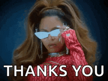 a woman wearing sunglasses and a red shirt says thanks you