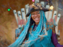 a woman with blue braids is wearing a hat