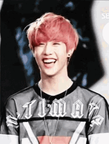 a young man with red hair is wearing a shirt that says i 'm a
