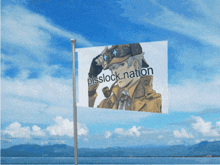 a flag with a picture of a man and the words pisslock nation written on it