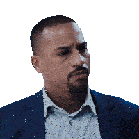a man with a beard is wearing a suit and a white shirt