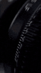 a blurred image of a steering wheel with a few buttons on it
