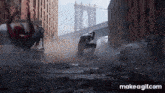 a man in a spiderman costume is flying through the air on a city street