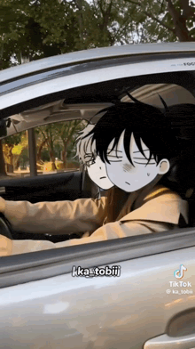 a man is driving a car with two anime characters looking out the window .