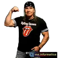 a man wearing a rolling stones t-shirt is waving his hand