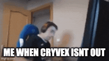 a man is sitting in front of a computer with the words me when cryvex isnt out