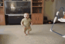 a baby is running in a living room in front of a tv