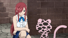 a girl with red hair is sitting next to a pink animal