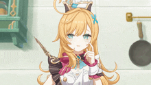 a girl with long blonde hair is wearing a chef 's hat and holding a knife