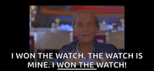 a man in a blue jacket is talking about winning a watch .