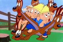 a group of pigs and dogs are playing with a football .