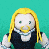 a figurine of a man with long blonde hair and a beard