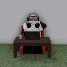green penguin in a chair gaming gamer