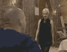a man and a woman are standing next to each other