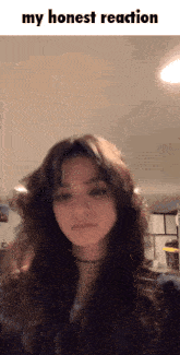 a picture of a girl with the words " my honest reaction " above her