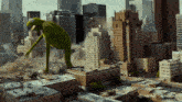 a giant kermit the frog is standing in a city