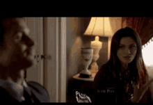 a man and a woman are standing in a room with julie pec written on the bottom of the screen