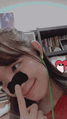 a girl with a black nose sticker on it