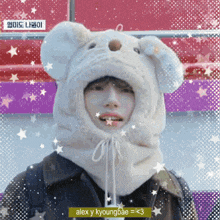 a picture of a person wearing a bear hat with alex y kyoungbae written on the bottom