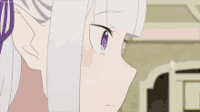 a close up of a girl 's face with a purple eye