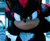a close up of a stuffed shadow the hedgehog with red hair