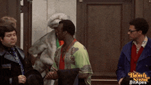 a group of men are standing in front of a door that says bowie star