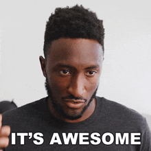 a man with a beard has the words it 's awesome written on his face
