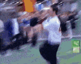 a blurry picture of a person standing in front of an exit sign
