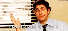 a man in a suit and tie is making a funny face and asking if he 's tried not caring .