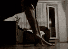 a person 's feet are shown in a living room