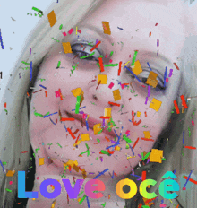 a woman 's face is surrounded by colorful confetti and the words love oce