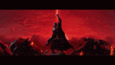 a man in a black cape is holding a light saber in front of a red sky