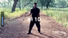 a man is standing on a dirt road with the number 10 on the bottom
