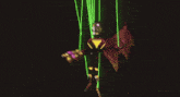 a video game character is being lit up by a spotlight with a city behind him