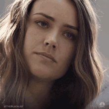 a close up of a woman 's face with the hashtag #theblacklist at the bottom
