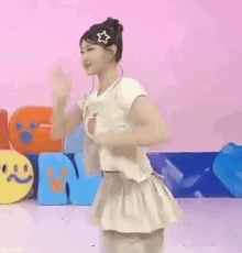 a woman in a white dress is bending over in front of a sign that says ' n '