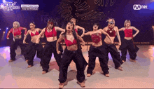 a group of women are dancing in front of a sign that says vote for 4th tokyo