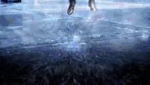 a person jumping into a body of water with their feet in the air