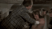 Airplane Movie GIF - Slapped Abused United Airlines GIFs
