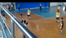 a group of young boys are playing basketball on a court and one of the boys has the number 43 on his shirt