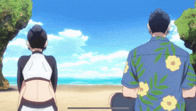 a man in a blue shirt with yellow flowers sits next to a woman on the beach
