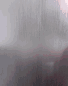 a close up of a gray surface with a few lines on it