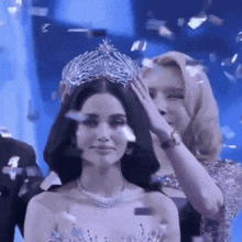 a woman is wearing a crown on her head