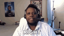 a man wearing a headset says right in front of him