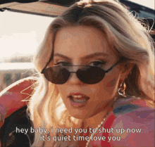 a woman wearing sunglasses says " hey baby , i need you to shut up now . it 's quiet time love you "