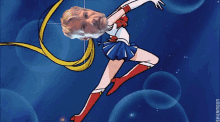 a cartoon of a woman in a sailor moon outfit with a man 's face on her head