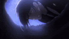 a person is laying in the dark with a blue sky behind them