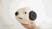 a person is holding a snoopy shaped pastry in their hand and they are using the hashtag yedy101