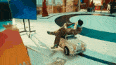 a man in a suit is sitting in a small car .