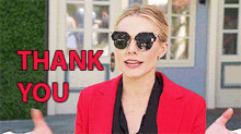 a woman wearing sunglasses says thank you